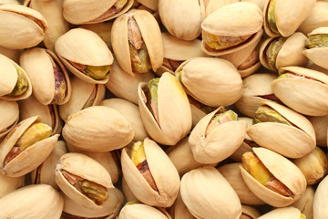 Salted pistachio nuts background