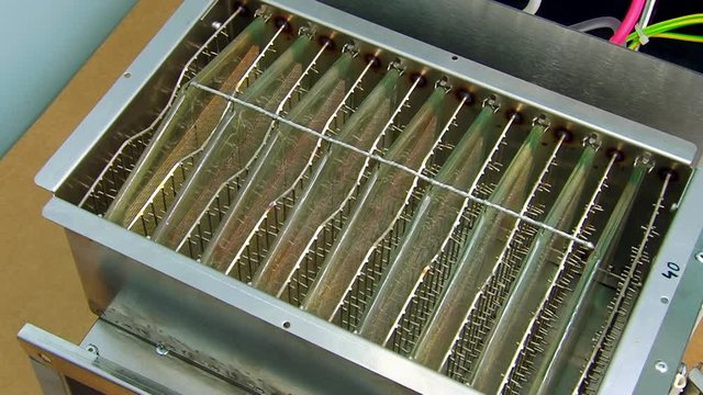 Cartridge of electrostatic precipitator purifies air particles at high voltage.
