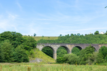 Fototapeta na wymiar Headstone Viaduct in the Monsal Dale in summer. Photo taken in the English Peak District, Derbyshire, UK