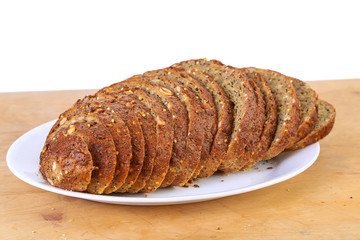 Sliced Loaf of Pumpkin Seed Bread on White BG with copy space