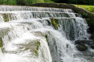 The waterfalls at the River Wye by the Monsal Dale in the English Peak District, Derbyshire, UK