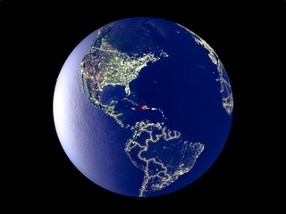 Haiti from space on model of planet Earth with city lights. Very fine detail of the plastic planet surface and cities.