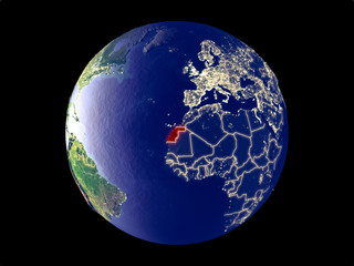 Western Sahara from space on model of planet Earth with city lights. Very fine detail of the plastic planet surface and cities.