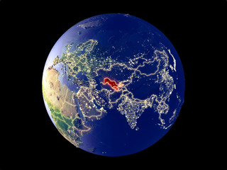 Uzbekistan from space on model of planet Earth with city lights. Very fine detail of the plastic planet surface and cities.