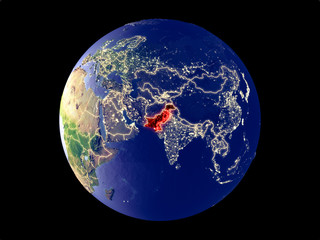 Pakistan from space on model of planet Earth with city lights. Very fine detail of the plastic planet surface and cities.