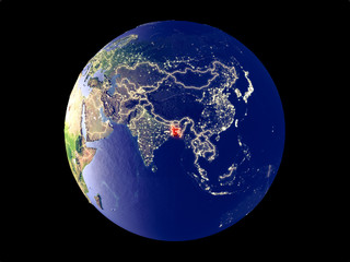Bangladesh from space on model of planet Earth with city lights. Very fine detail of the plastic planet surface and cities.