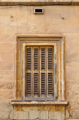 Vintage window with wooden shutters