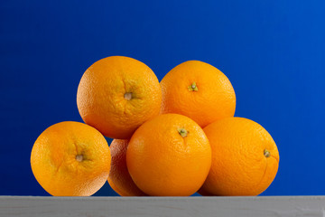 Bright Oranges on Blue Backdrop