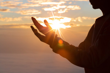 Silhouette of christian man hand praying,spirituality and religion,man praying to god. Christianity...