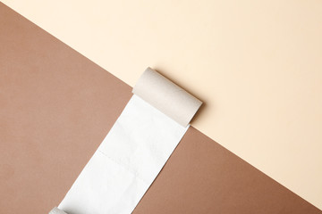 Flat lay composition with empty roll and toilet paper on color background. Space for text
