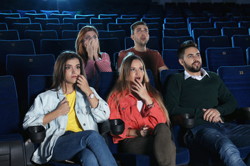 Fototapeta premium Young people watching movie in cinema theatre