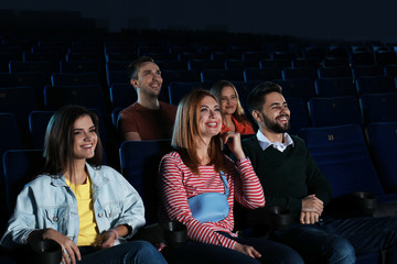 Young people watching movie in cinema theatre © New Africa