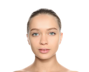 Fototapeta premium Portrait of young woman with foundation on her face against white background