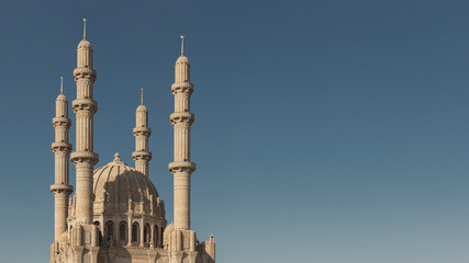 view of the majestic mosque with 4 towers against the clear sky