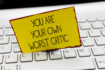 Handwriting text writing You Are Your Own Worst Critic. Concept meaning too hard on self No to...
