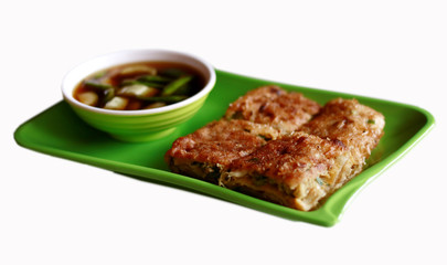 Martabak Telur and green chili. A square crepes filled with mixture of egg, green onion and minced beef.