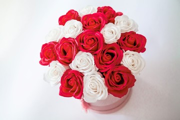 Red and White roses bouquet as a gift on St Valentine's Day isolated on a white background, view from above