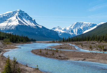 River along Icefields Parkway / Highway 93 in the Jasper National Park in spring - Alberta, Canada