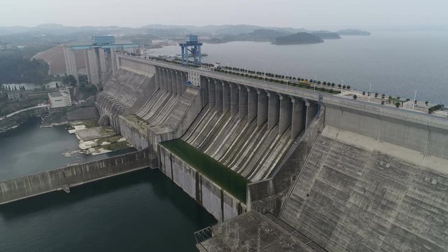 Drone shot flying along Danjiangkou dam, part of the South-North water transfer project, infrastructure and engineering in China
