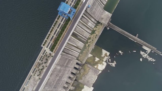 Overhead drone shot of Danjiangkou dam in China, showing water level difference between reservoir and river