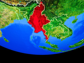 Myanmar from space on model of planet Earth with country borders.