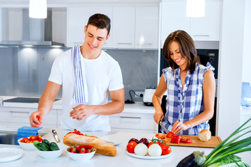 Young couple cooking at home