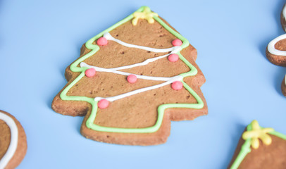 Christmas gingerbread cookies isolated on light blue pastel background