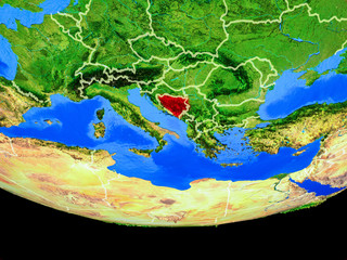 Bosnia and Herzegovina from space on model of planet Earth with country borders.