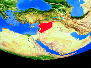 Syria from space on model of planet Earth with country borders.