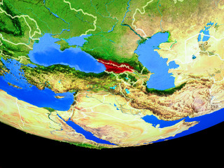 Georgia from space on model of planet Earth with country borders.