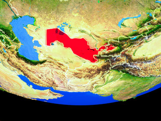 Uzbekistan from space on model of planet Earth with country borders.