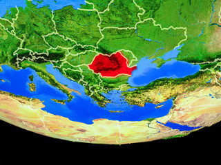 Romania from space on model of planet Earth with country borders.
