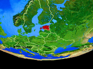 Estonia from space on model of planet Earth with country borders.