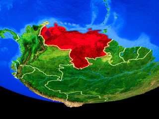 Venezuela from space on model of planet Earth with country borders.