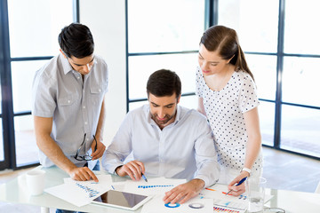 Group of happy young business people in a meeting