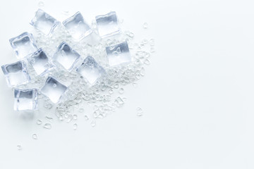 pile of ice cubes on white bar table top view mock-up