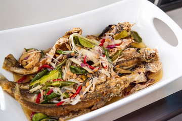 Indonesian food fried fish cooked with taucu or ikan masak tauco