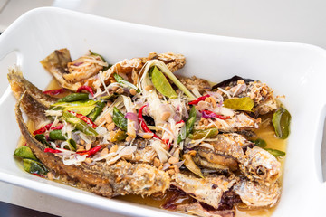 Indonesian food fried fish cooked with taucu or ikan masak tauco