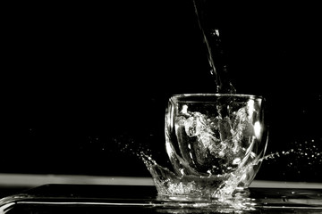 Water splash from the transparent glass