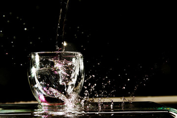 Water splash from the transparent glass