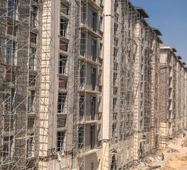 marble finishing works on the facade of a high building