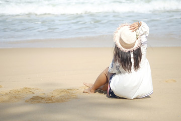 one girl sit on the sand