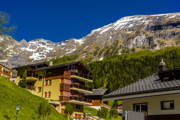 Fototapeta na wymiar Chalet and hotels in swiss village in Alps, Leukerbad, Leuk, Vis