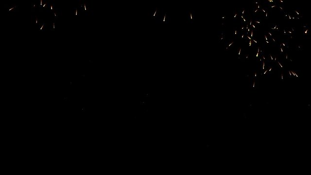 Group of beautiful shimmering fireworks spreading in the sky in celcbration night