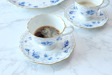 cup of coffee on white table