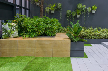 Beautiful fabric pillow with green natural plant gardening of relax zone exterior for home and living decoration. Concept environment house contemporary