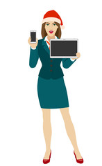 Businesswoman in Santa hat holding a mobile phone and digital tablet PC