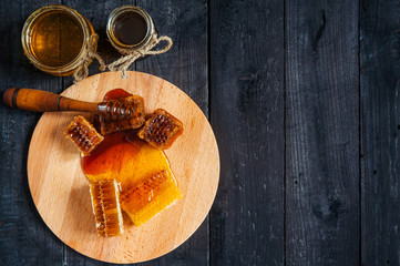 Honeycombs and two jars of honey