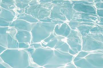Texture of water in swimming pool for background
