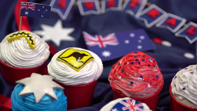 Australian themed cupcakes for a party. Handmade decorations. Flag, kangaroo road sign, boomerang, seven-pointed star, koala
